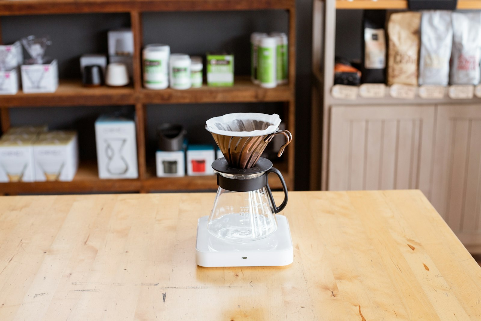 Pour-over coffee brewer on a desk, illustrating caffeine and hydration for athletes