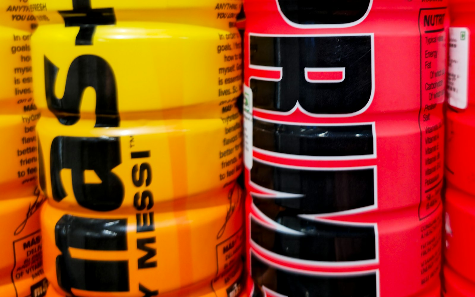 A colorful lineup of different sports and hydration drink bottles — illustrating how isotonic, hypotonic, and hypertonic formulas differ in concentration.
