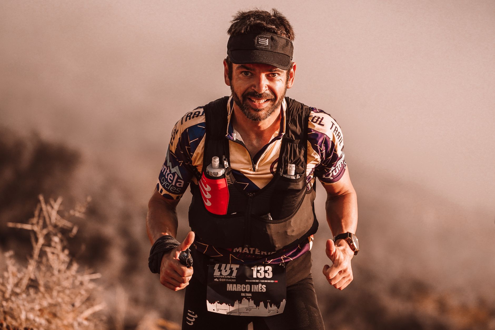 Determined trail runner participating in a race, showing perseverance and athleticism.