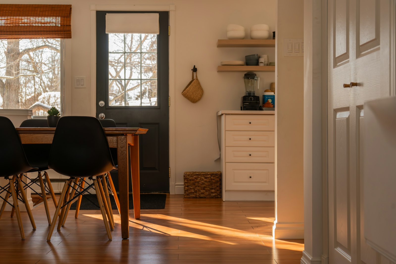 Sunlight streaming into an empty kitchen in the early morning